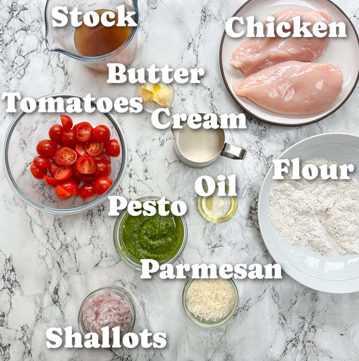overhead shot of creamy pesto chicken ingredients with text labels